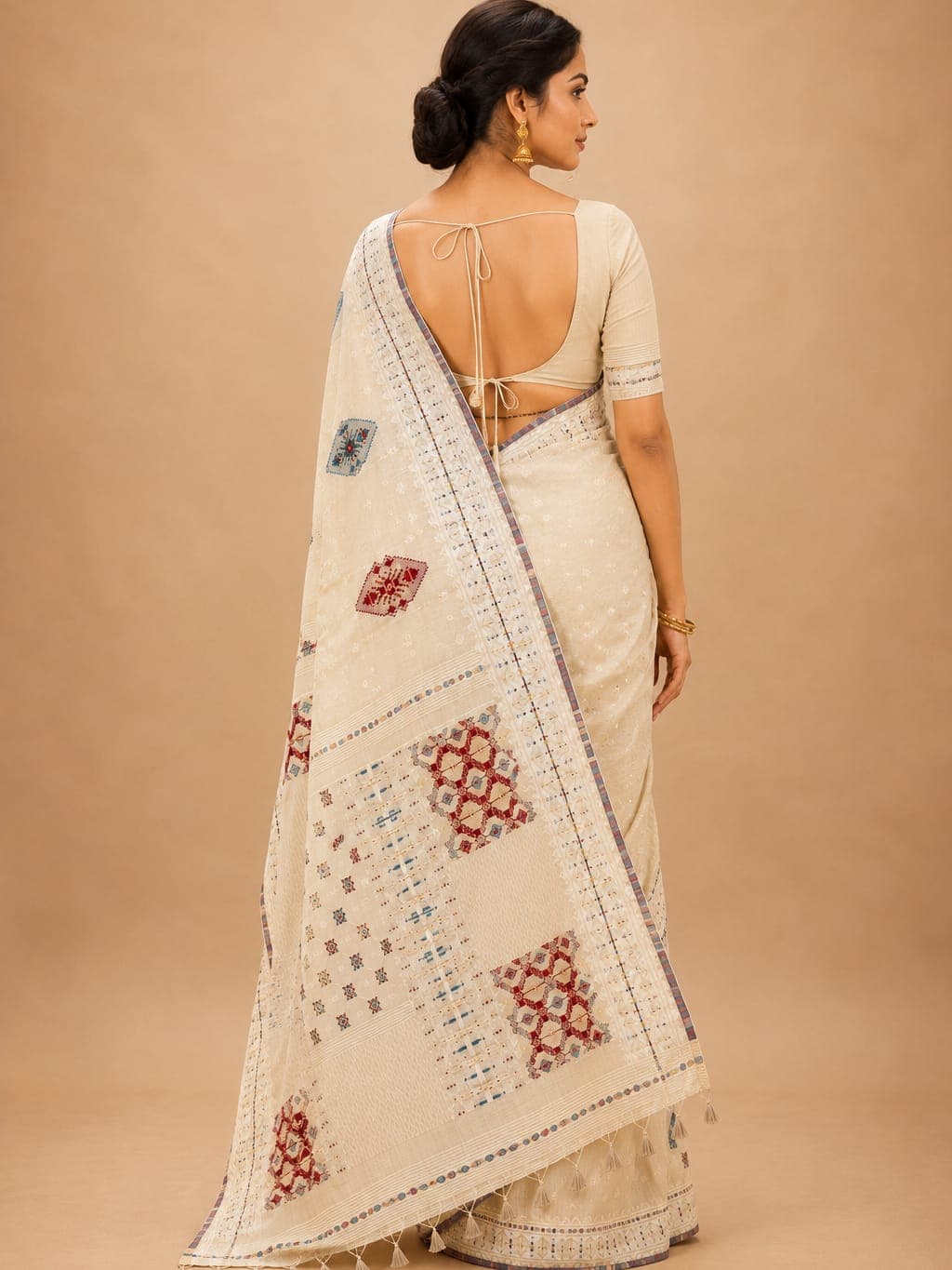 Elegant Cream Printed Cotton Saree with Tassels — the weave up close